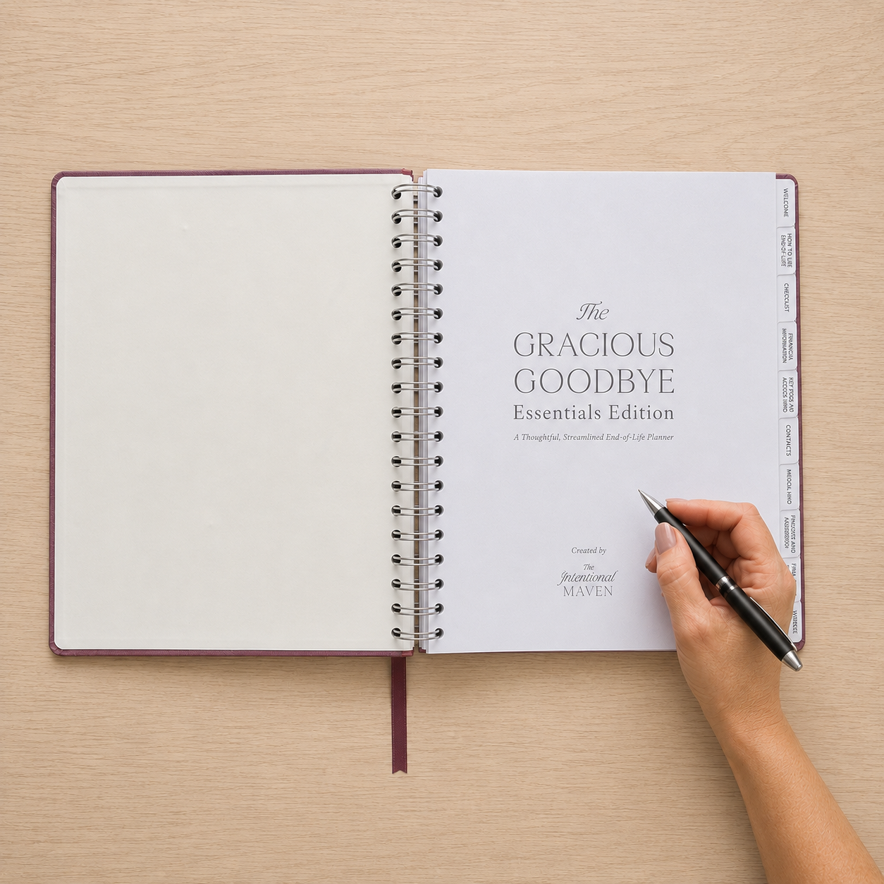 The Gracious Goodbye Essentials planner open flat with a hand holding a pen on the introduction page.