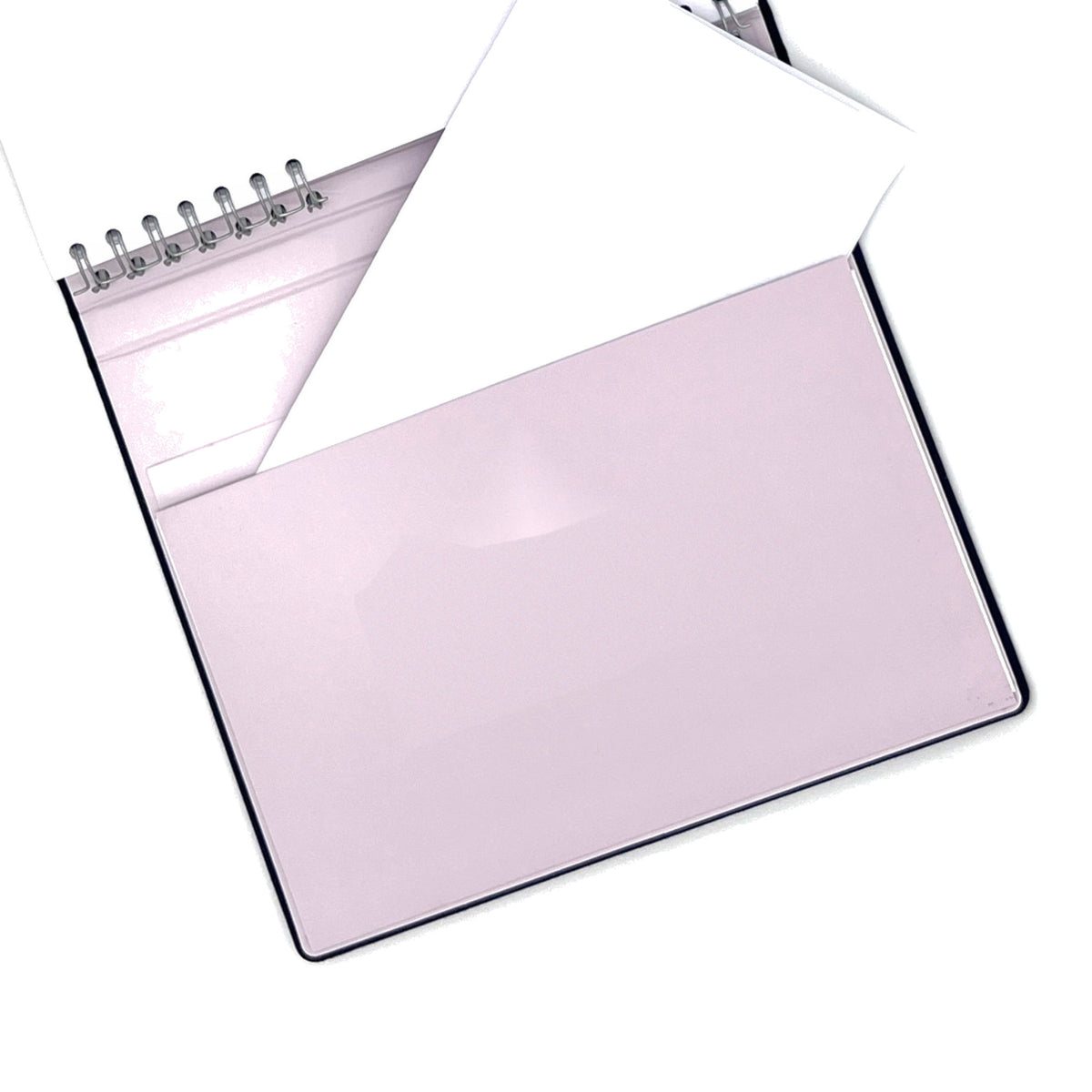 The large built-in back pocket of The Gracious Goodbye Essentials with a folded document tucked inside.