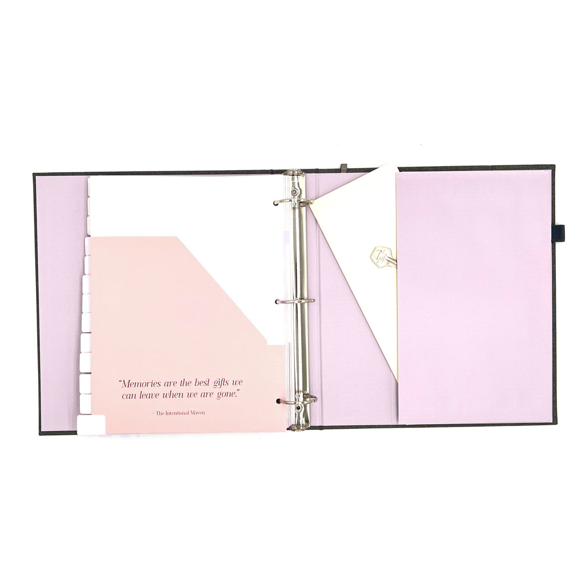 The Gracious Goodbye planner open to a divider pocket and the large accordion back pocket, holding an envelope and a key.